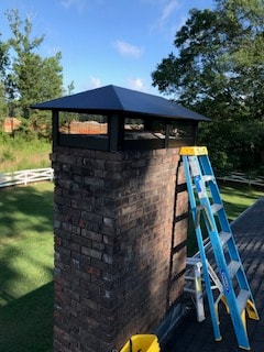 Chimney shroud installation with ladder — Westbrook Roofing and Remodeling job site