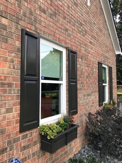 New window installation with black shutters — brick home, metro Atlanta, GA