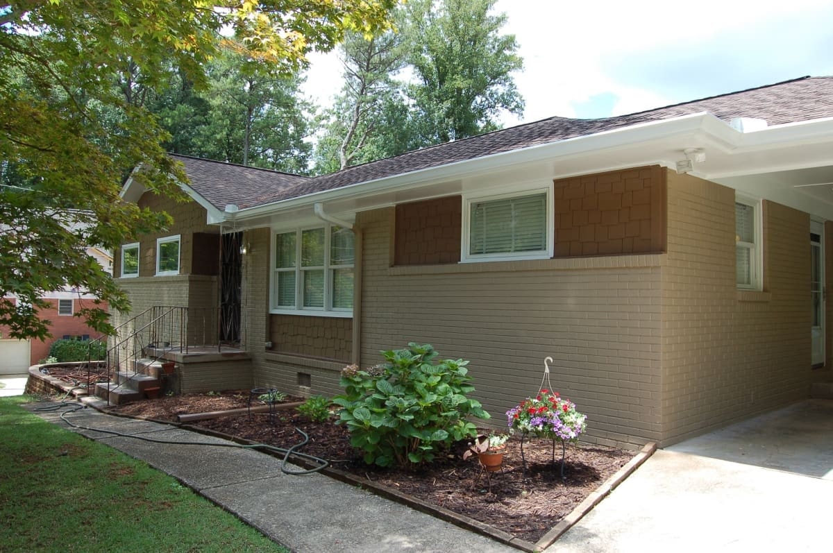 Completed roof replacement on a mid-century modern brick home