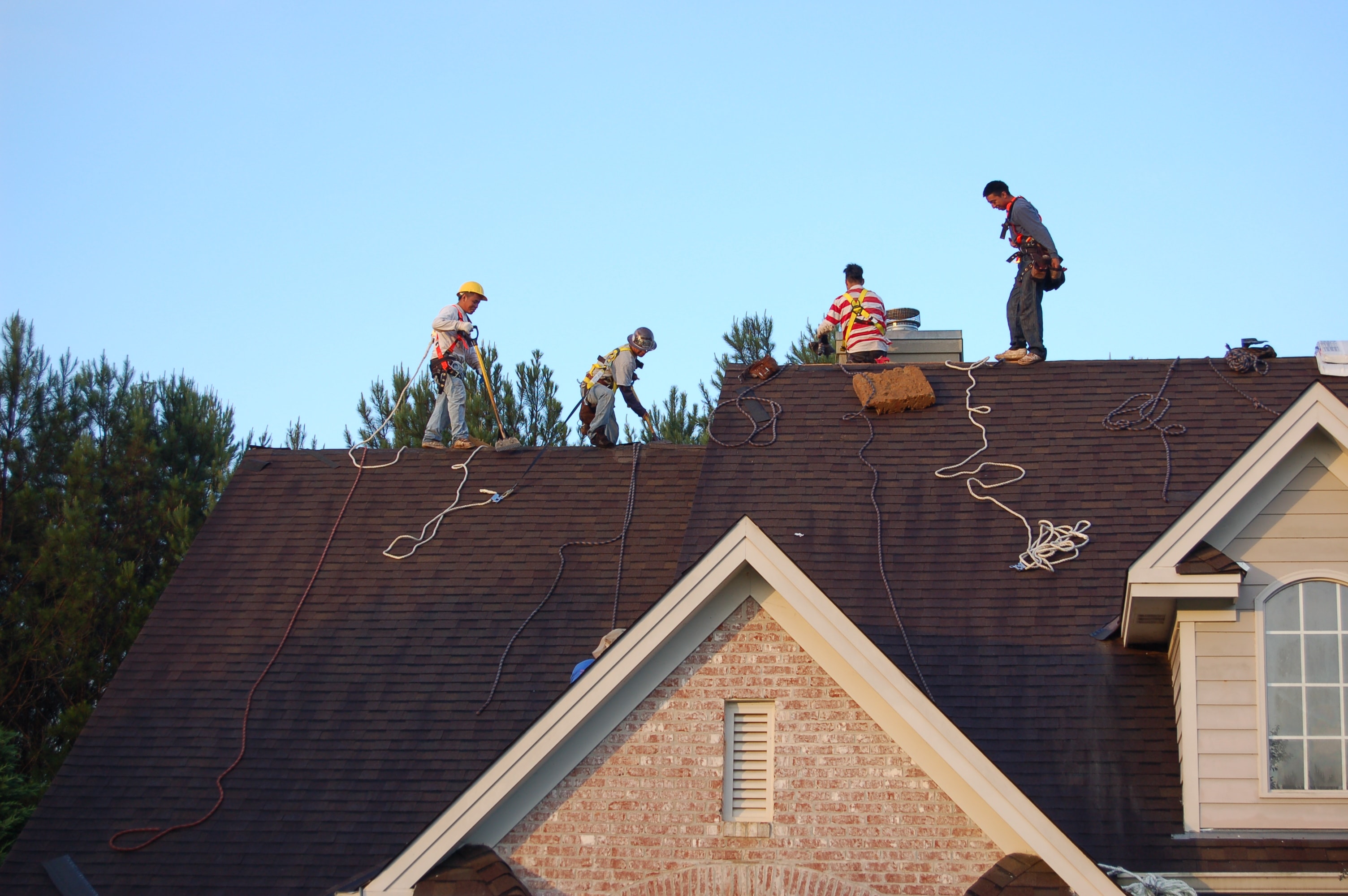 Westbrook crew on residential roof with safety harnesses — roofing project, Tucker, GA