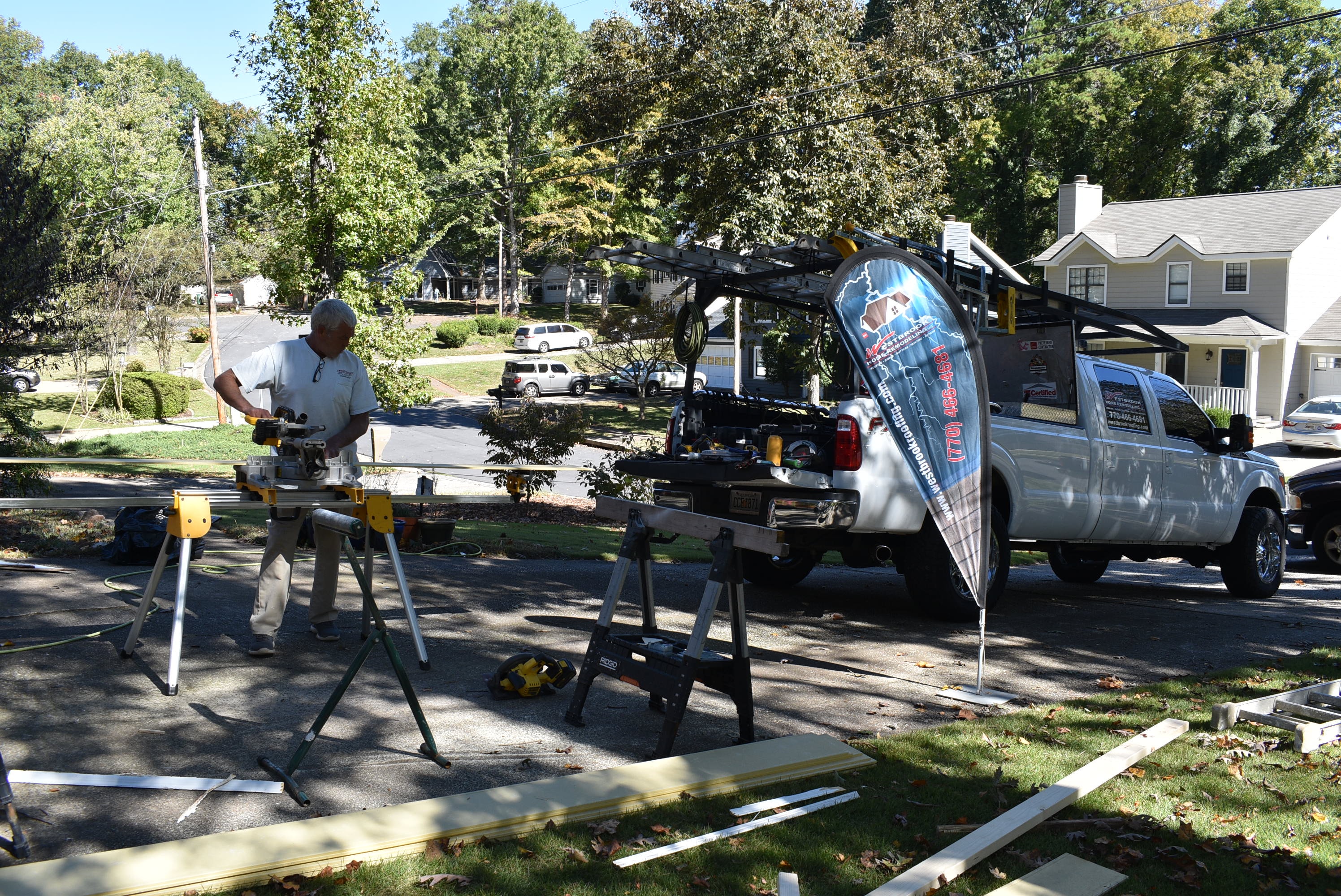 Westbrook crew cutting and fitting siding panels on-site in metro Atlanta, GA