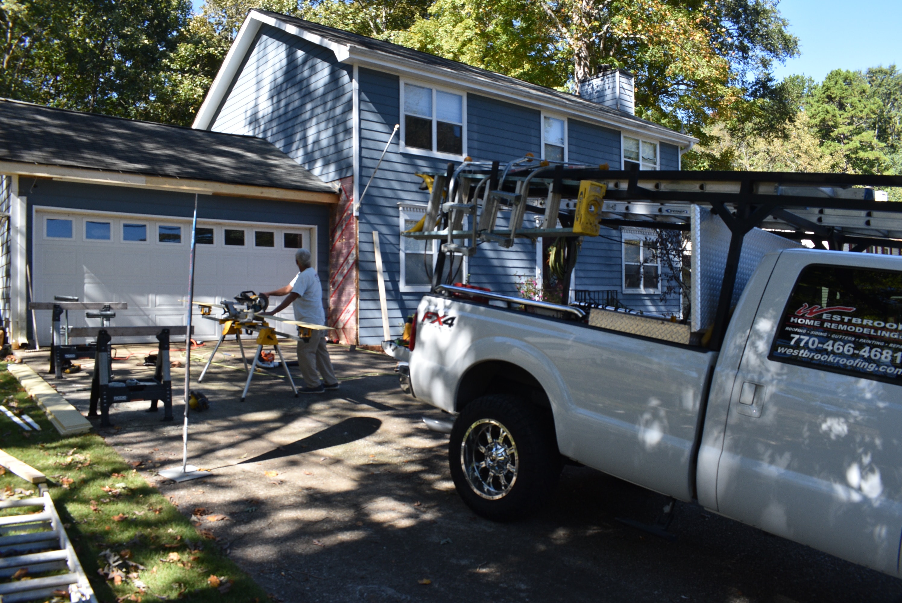 Westbrook truck and crew on a soffit and fascia job site in metro Atlanta