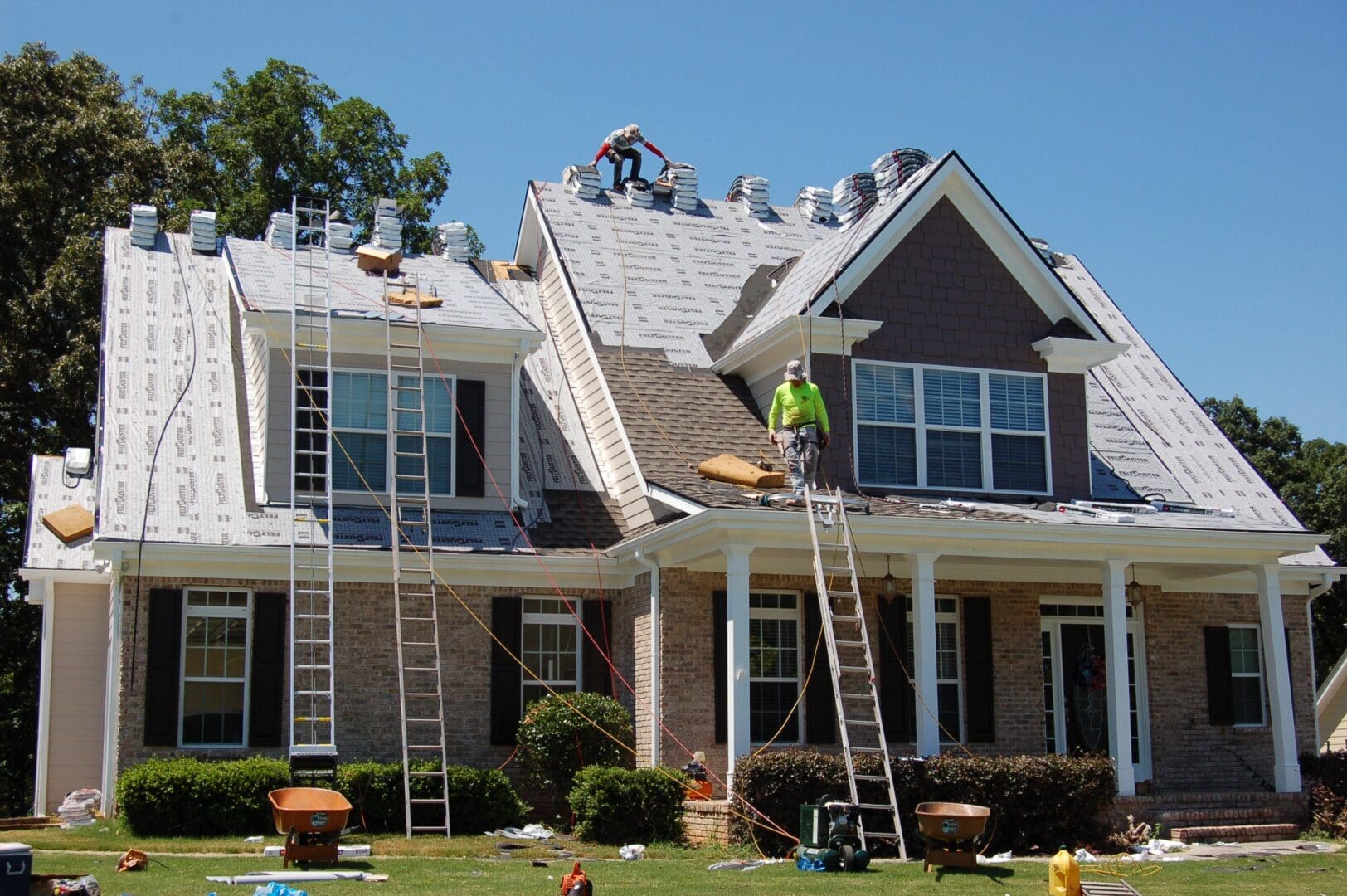 A roofing crew working on a roofing construction project