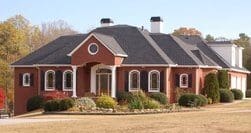 A large red house with a lot of windows